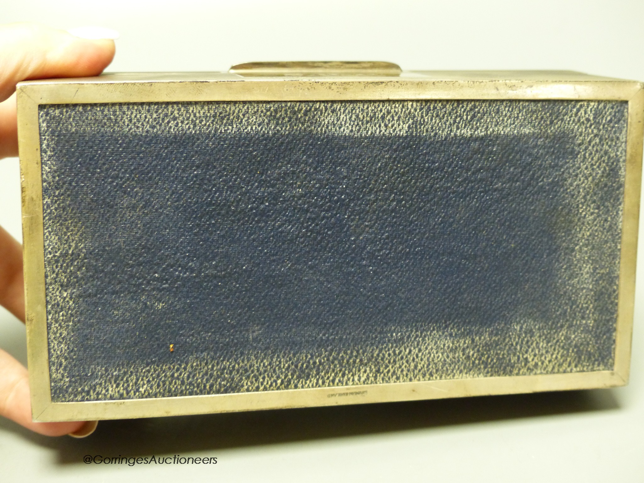 A late 1960's engine turned rectangular silver cigarette box, by Mappin & Webb, Birmingham, 1968, 16.6cm, gross 16.5oz.